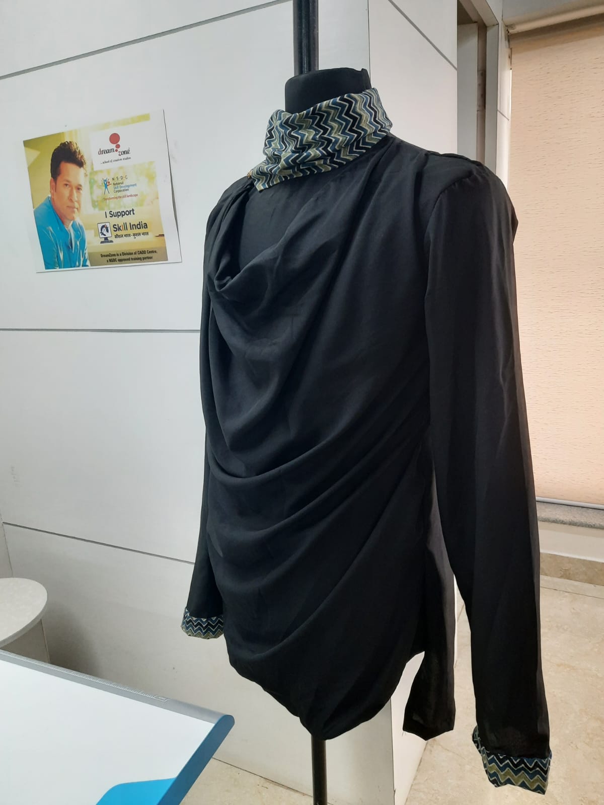 Black cowl-neck tunic with zigzag trim
